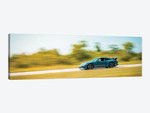 Blue Porsche On The Track In Motion