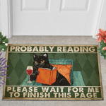 Cat reading book Probably reading please wait for me to finish this page Doormat