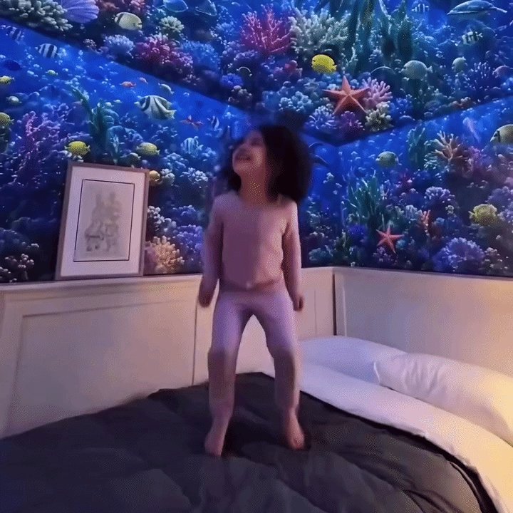 Velasay Projector filling a bedroom with ocean light