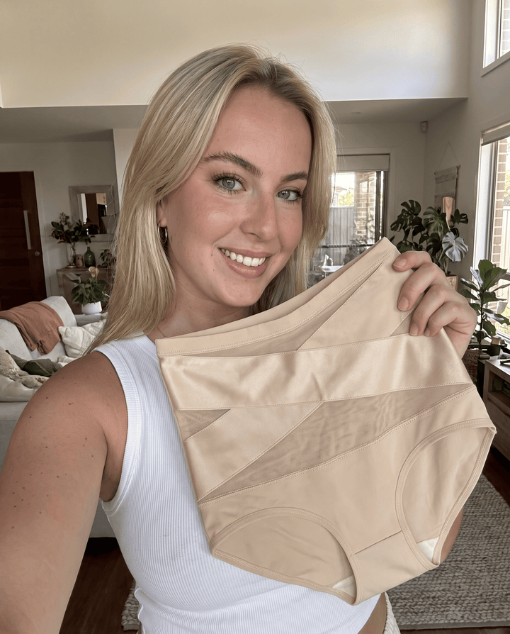Megan K., 33 hält ihren ILONOU Shape-Slip